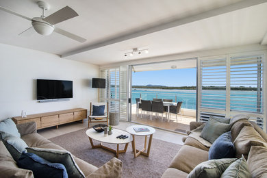 Photo of a beach style home design in Sunshine Coast.