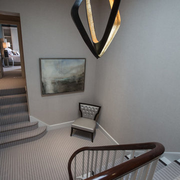 Striped carpet stair with occasional chair and Porta Romana Pendant