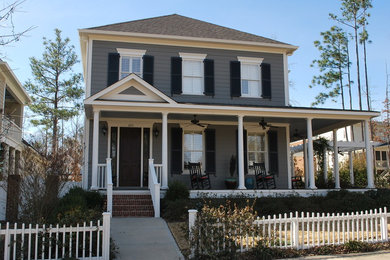 Mid-sized traditional gray two-story wood house exterior idea in Birmingham with a hip roof and a shingle roof