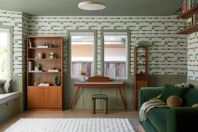 Inspiration for a large contemporary light wood floor, wallpaper, wainscoting and beige floor family room remodel in San Francisco with green walls