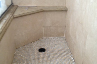 Travertine mosaic walk in shower floor replace and repair  leak .