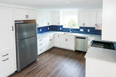 Example of a beach style kitchen design in Portland Maine