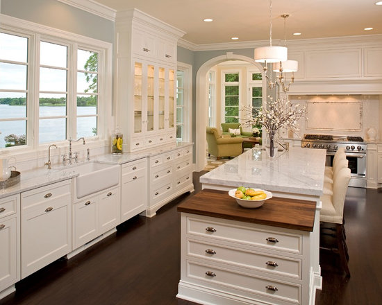 Large traditional eat-in kitchen ideas - Inspiration for a large timeless u-shaped dark wood floor and brown floor eat-in kitchen remodel in Minneapolis with a farmhouse sink, marble countertops, beaded inset cabinets, white cabinets, white backsplash, subway tile backsplash, stainless steel appliances and an island