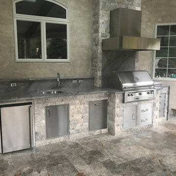 Elegant Outdoor Kitchen with Mitered Waterfall Quartzite