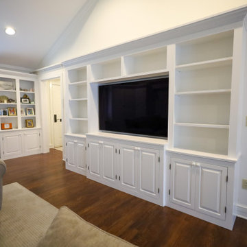 Statement-Making Living Room: Custom White Built-In Entertainment Center with Op