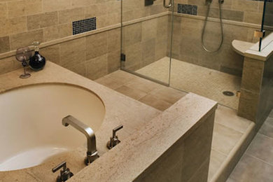Photo of an expansive modern master bathroom in San Francisco with a drop-in tub, a corner shower and beige walls.