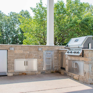 Open Gable Pool House with Fireplace and Grilling Area