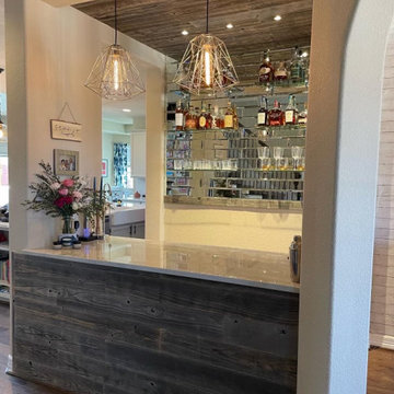 Custom built bar area, installed antique glass tiles, custom cabinetry and wood