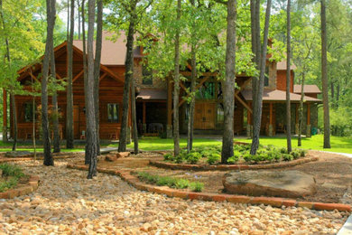 Design ideas for a large rustic partial sun front yard gravel formal garden in Houston.