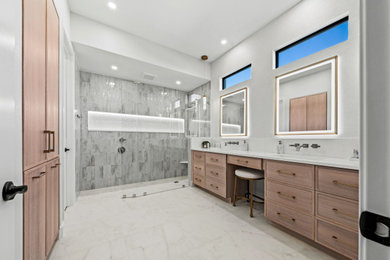 Bathroom - transitional master gray tile and porcelain tile porcelain tile, white floor and double-sink bathroom idea in Other with shaker cabinets, light wood cabinets, a two-piece toilet, white walls, an undermount sink, quartz countertops, white countertops, a niche and a built-in vanity