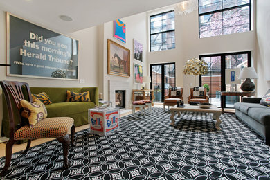 Inspiration for a large eclectic open concept family room in New York with white walls, light hardwood floors, a standard fireplace and a tile fireplace surround.