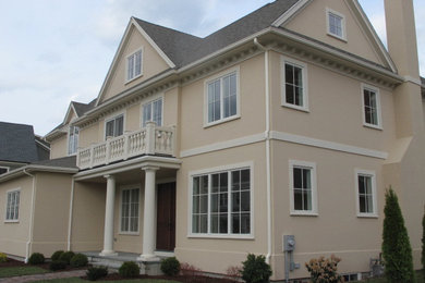 Example of a transitional home design design in Boston
