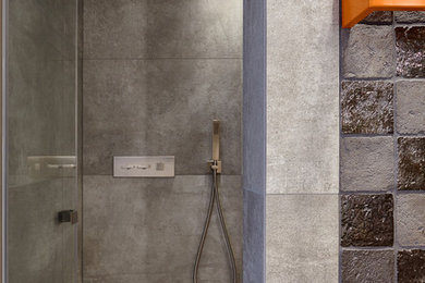 Design ideas for a large industrial 3/4 bathroom in Cologne with dark wood cabinets, a curbless shower, a wall-mount toilet, gray tile, terra-cotta tile, white walls, ceramic floors, an integrated sink, tile benchtops, grey floor and grey benchtops.