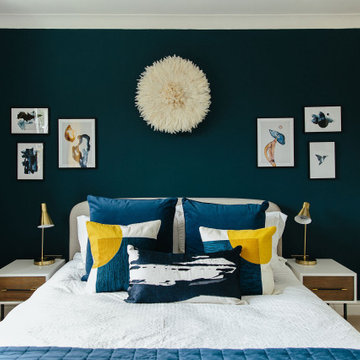 Blue bedroom with bright yellow and gold accents