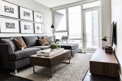 Inspiration for a small contemporary enclosed dark wood floor living room remodel in Vancouver with white walls and a wall-mounted tv