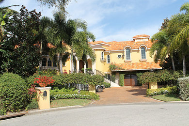 Example of a tuscan exterior home design in Tampa