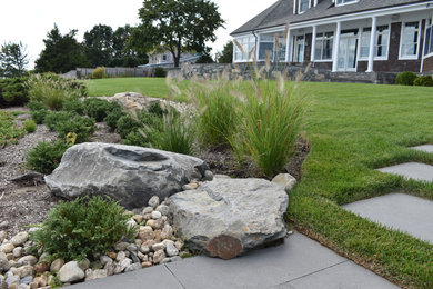 Inspiration for a large transitional rock and full sun backyard river rock formal garden in Providence for summer.