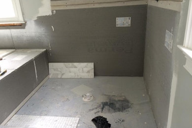 Example of a mid-sized classic 3/4 black and white tile and ceramic tile ceramic tile and black floor bathroom design in Newark with open cabinets, beige cabinets, a hot tub, a one-piece toilet, black walls, a pedestal sink and soapstone countertops