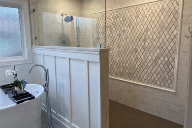 Bathroom - large traditional master white tile and porcelain tile porcelain tile, brown floor, double-sink and wall paneling bathroom idea in Portland with dark wood cabinets, white walls, an undermount sink, quartz countertops, white countertops and a built-in vanity