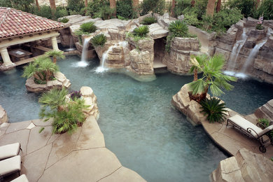 Island style pool photo in Las Vegas