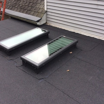 Self adhered rolled roofing and new skylights on aluminum three season room.