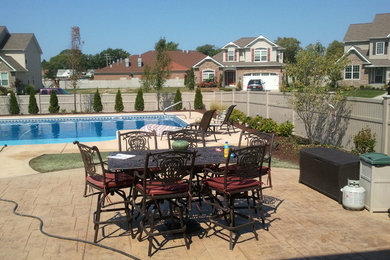 Photo of a large traditional full sun backyard stone landscaping in Cleveland.