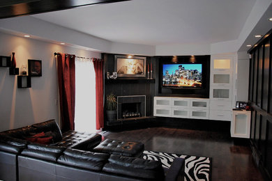 Mid-sized trendy formal and open concept living room photo in Calgary with white walls and a wall-mounted tv
