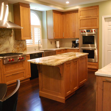 MEDIUM STAIN CABINETRY WITH ROMA IMPERIALE QUARTZITE