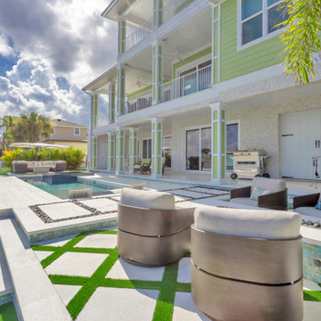 Waterfront Patio with Modern Pool and Custom Outdoor Living