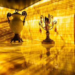 Design ideas for a small mediterranean separated utility room in Seattle with raised-panel cabinets, black cabinets, onyx worktops and yellow worktops.