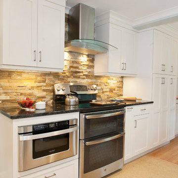 View of Stainless Range, Hood and Built in Microwave