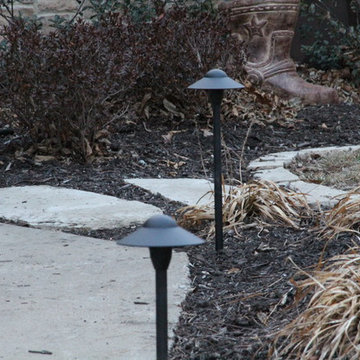 Deck lighting using low voltage under railing LED lights.