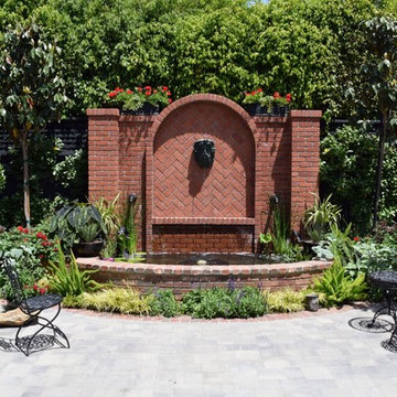 Brick Fountain and koi pond with planters