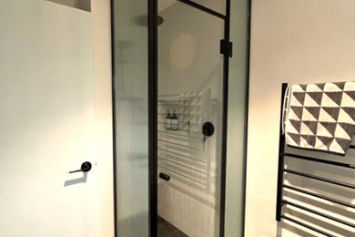Flute glass shower screens with black angle trim
