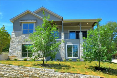 Example of a gray two-story mixed siding exterior home design in Austin