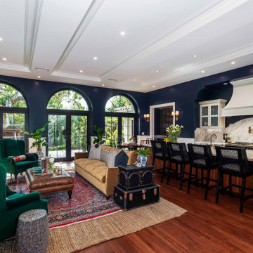 Traditional Open Concept Living Room and Kitchen with Navy Walls and Arched Door