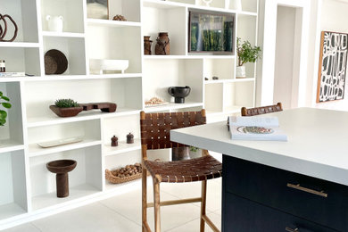 Large trendy u-shaped porcelain tile and gray floor eat-in kitchen photo in Sydney with an undermount sink, dark wood cabinets, quartz countertops, white backsplash, quartz backsplash, black appliances, a peninsula and white countertops