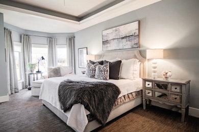 Large elegant master dark wood floor bedroom photo in Kansas City with gray walls and no fireplace