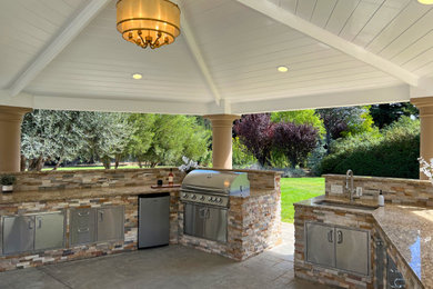 Large transitional backyard stamped concrete patio kitchen photo in San Francisco
