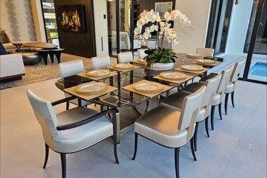Example of a huge trendy porcelain tile and white floor kitchen/dining room combo design in Miami with white walls and no fireplace