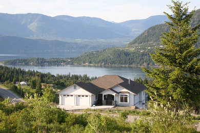 Inspiration for a mid-sized timeless two-story stucco exterior home remodel in Vancouver