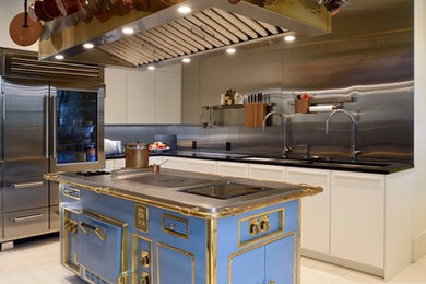 Photo of a mid-sized industrial l-shaped separate kitchen with an undermount sink, flat-panel cabinets, white cabinets, solid surface benchtops, metallic splashback, metal splashback, stainless steel appliances, porcelain floors, with island, white floor and grey benchtop.
