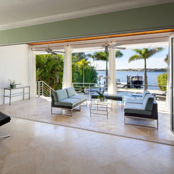 The NanaWall glass doors wide open to the Tampa Bay Fl water view