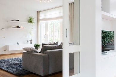 Example of a large trendy open concept living room design in Amsterdam