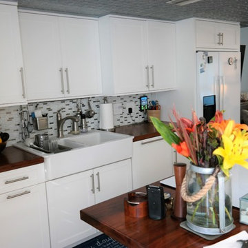 Cozy Cottage Style Kitchen with Muliple Use Island Maximizing Storage