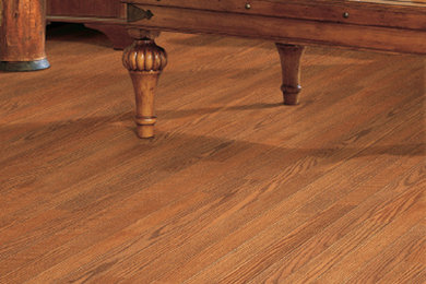 Inspiration for a medium tone wood floor living room remodel in Boston