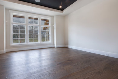 Mid-sized country open concept dark wood floor, brown floor and tray ceiling living room photo in Chicago with white walls