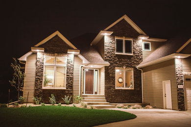 Inspiration for a transitional beige two-story vinyl exterior home remodel in Other