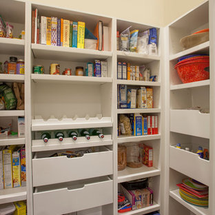 This is an example of a mid-sized contemporary galley kitchen pantry in Chicago with an undermount sink, flat-panel cabinets, white cabinets, quartz benchtops, grey splashback, glass tile splashback, stainless steel appliances, dark hardwood floors and a peninsula.