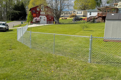 Design ideas for a backyard metal fence landscaping in Other.